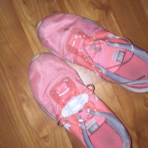 Pink Nike shoes with LED shoelaces